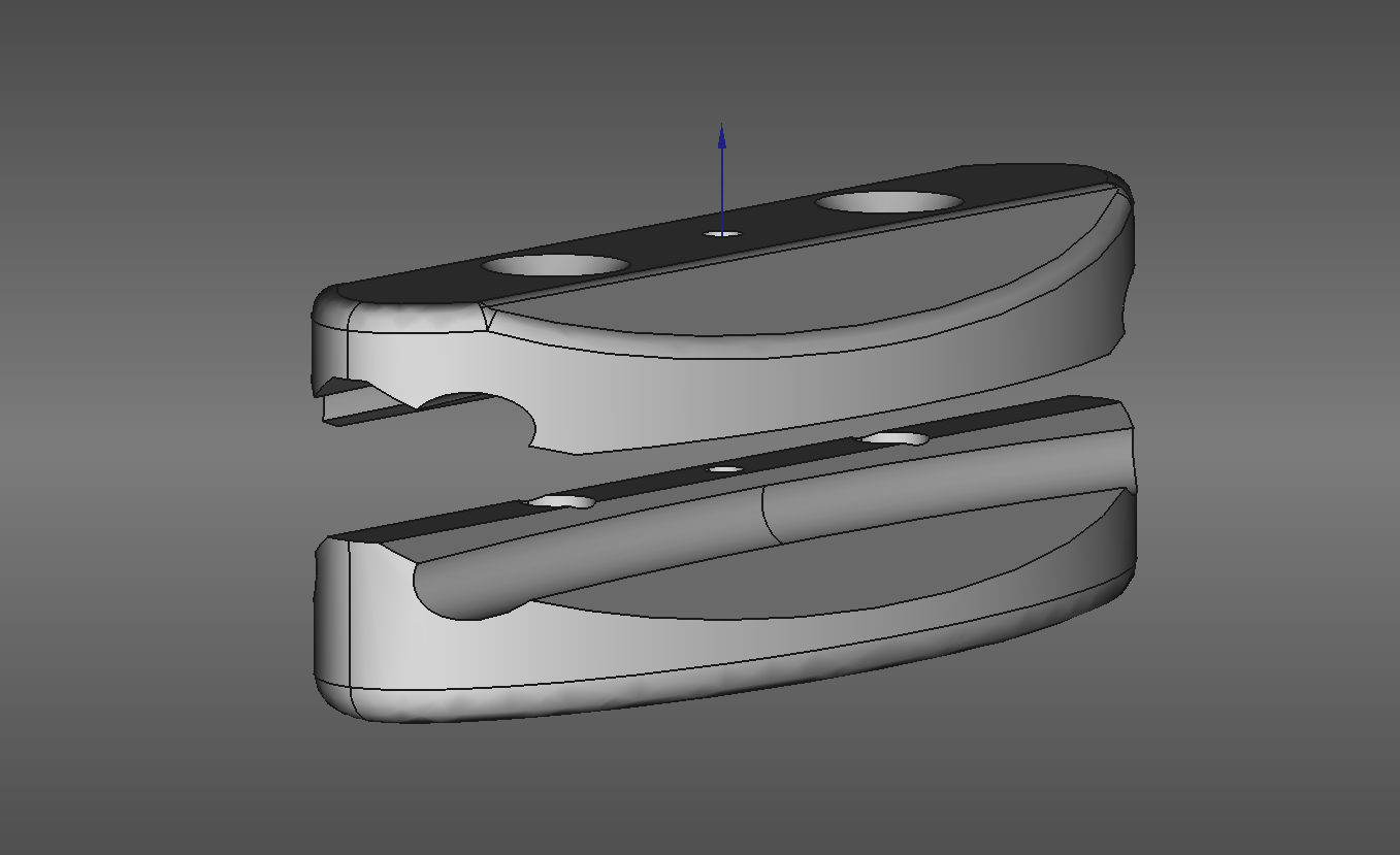 A CAD rendering of a two-part ovoid clip with top and bottom grooves to capture a metal hoop